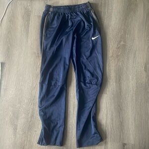 Nike. Navy blue pants w/ grey detailing